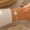 Pulsera con dije giratorio 1062
