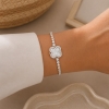 Pulsera con dije giratorio 1057